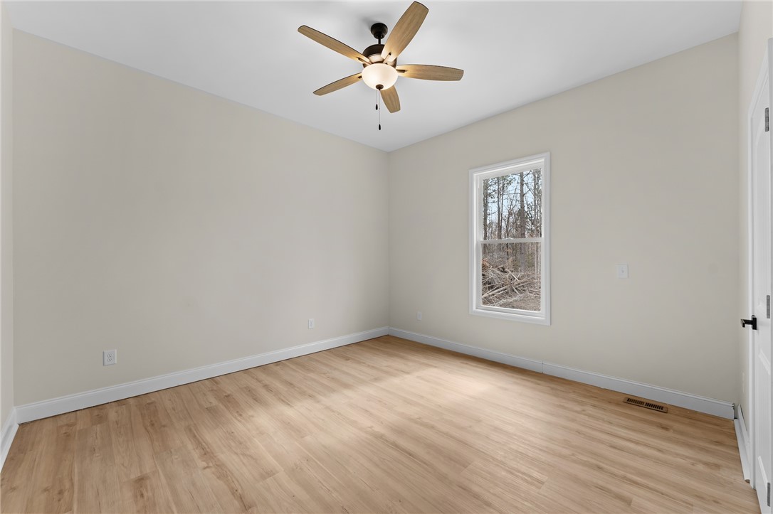 333 Lone Oak Road Anderson, SC 29621 - Photo 16 of 36 Bright and airy room with durable flooring and serene outdoor views.