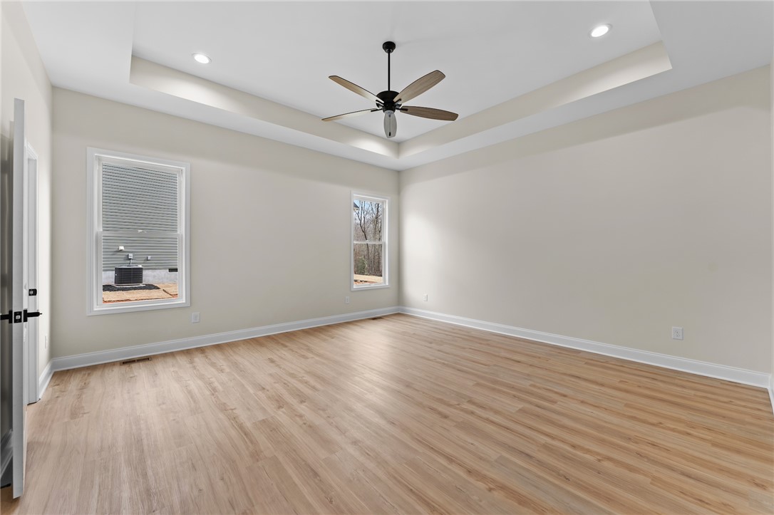 333 Lone Oak Road Anderson, SC 29621 - Photo 20 of 36 This spacious bedroom offers ample natural light and a serene atmosphere for relaxation.