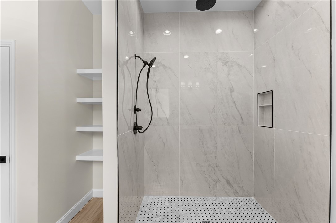 333 Lone Oak Road Anderson, SC 29621 - Photo 23 of 36 Modern shower with sleek fixtures and built-in shelving offers a spa-like retreat.