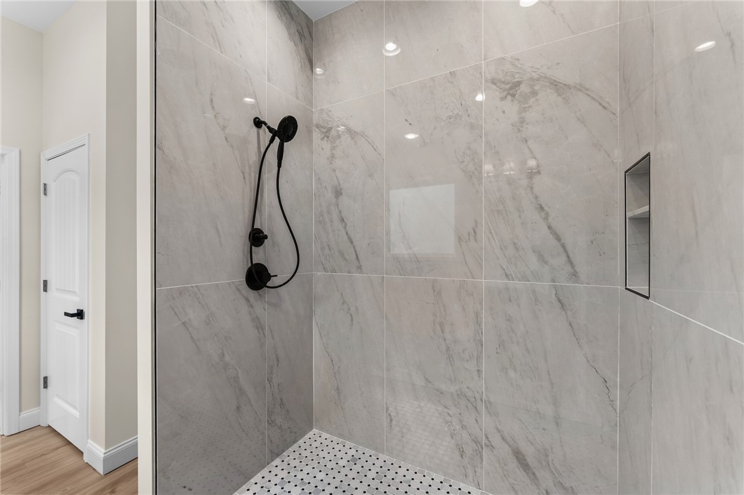 333 Lone Oak Road Anderson, SC 29621 - Photo 24 of 36 This sleek shower features modern fixtures and elegant tiled surfaces.