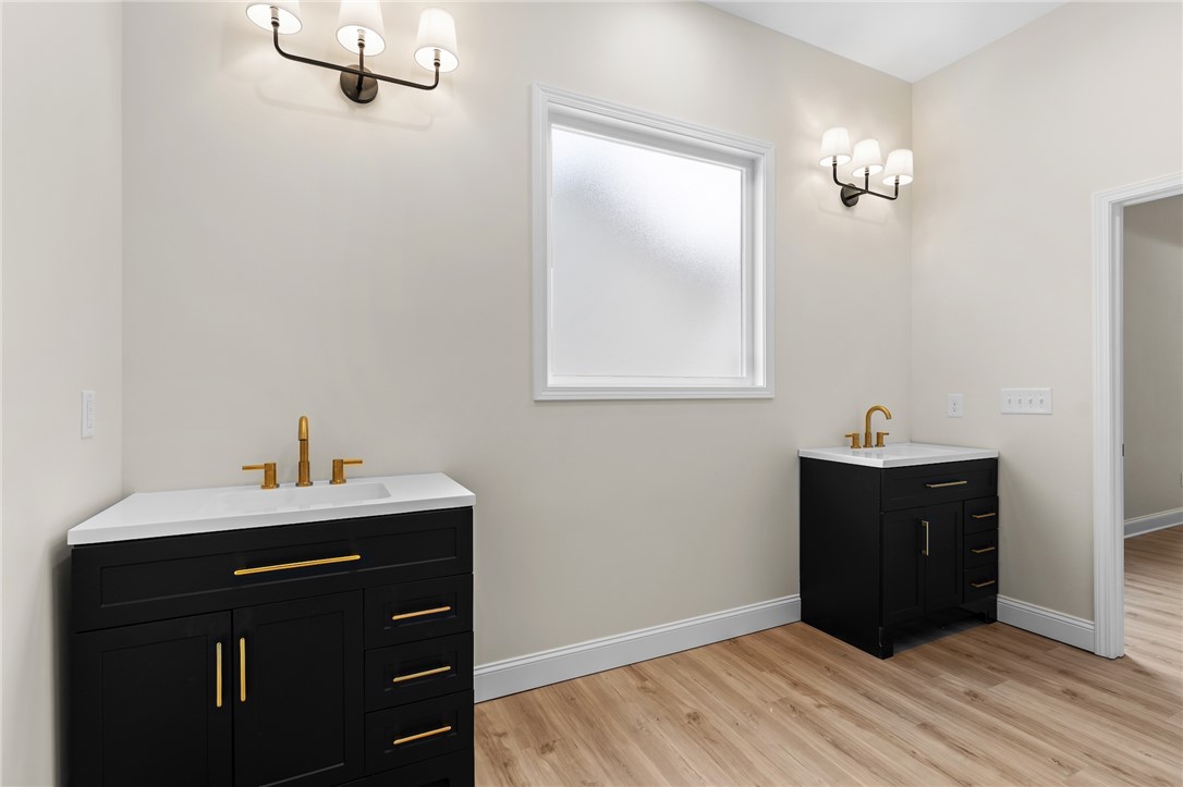 333 Lone Oak Road Anderson, SC 29621 - Photo 25 of 36 This bright bathroom features dual vanities and modern fixtures, creating a refreshing atmosphere.