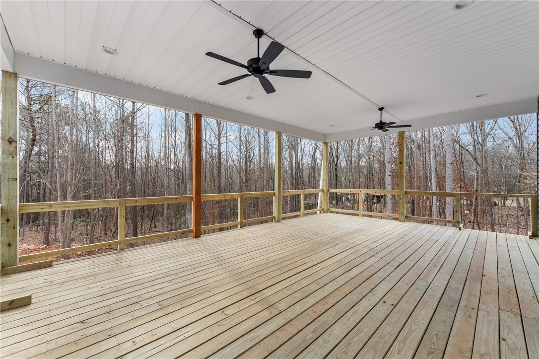 333 Lone Oak Road Anderson, SC 29621 - Photo 33 of 36 This spacious wooden deck offers serene views of the surrounding natural landscape.