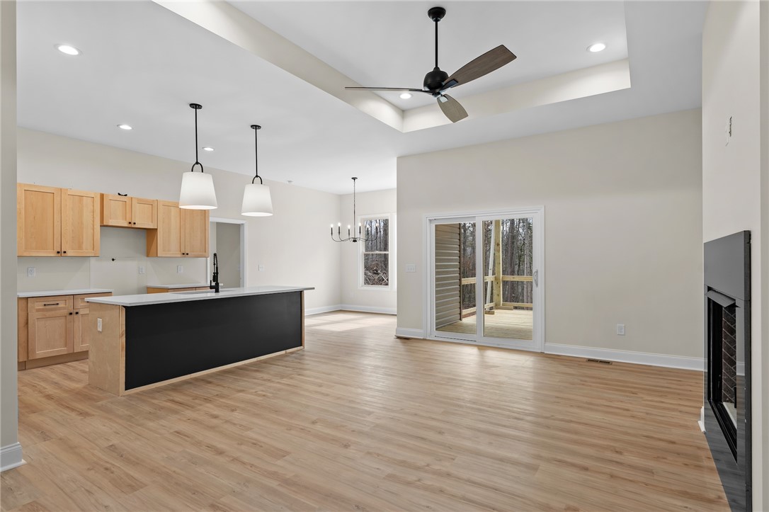 333 Lone Oak Road Anderson, SC 29621 - Photo 6 of 36 This bright, open-concept living space features warm flooring, modern fixtures, and a cozy fireplace.
