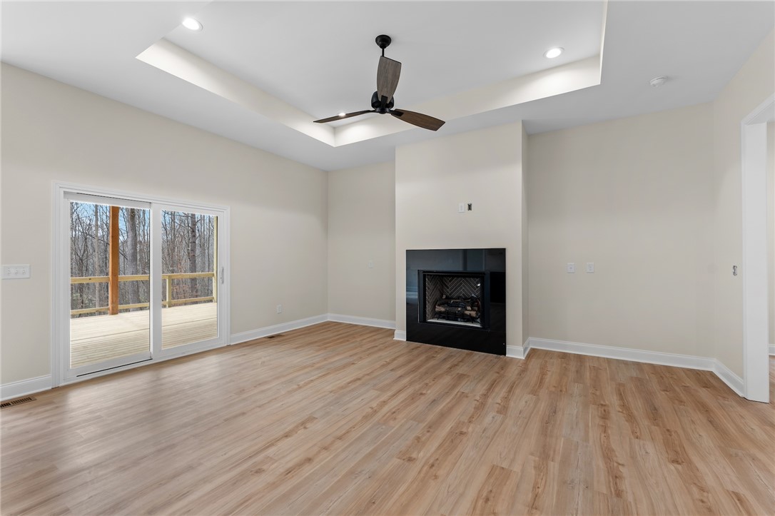 333 Lone Oak Road Anderson, SC 29621 - Photo 8 of 36 An inviting room features a fireplace and direct access to outdoor living.