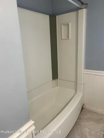 a view of a house with a backyard and deck