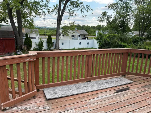 a view of a backyard with large trees