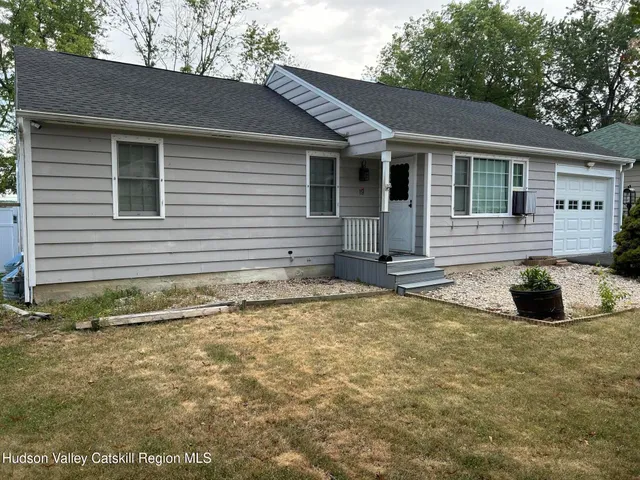 a house view with a backyard space