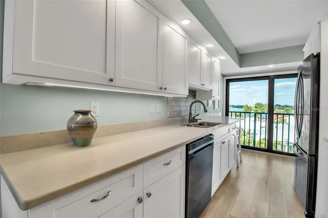 a kitchen with a sink and cabinets