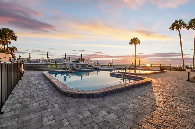 a view of a swimming pool with a terrace