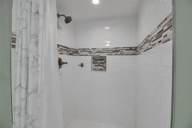 a close view of a shower in bathroom