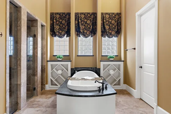 a view of a livingroom with furniture and a potted plant