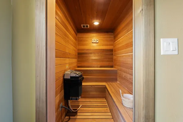 a living room with furniture a projector and a flat screen tv