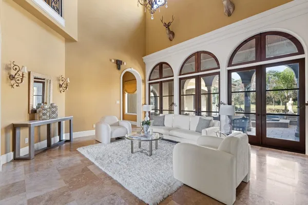 a large kitchen with a table and chairs