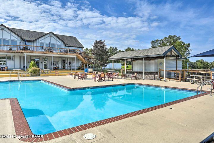 6114 Decker Road Bushkill, PA 18324 - Photo 51 of 65 a view of a house with pool and chairs