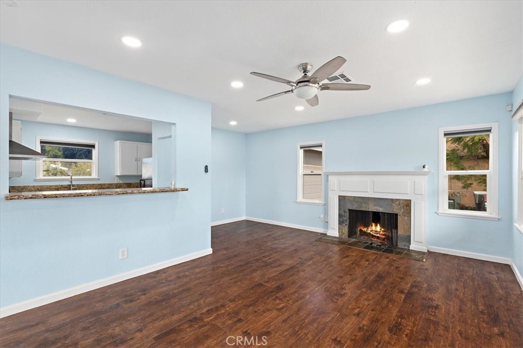 4485 Dwight Avenue Riverside, CA 92507 - Photo 2 of 15 a view of an empty room with kitchen and fireplace