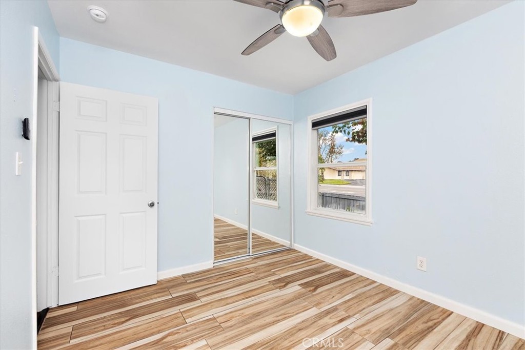 4485 Dwight Avenue Riverside, CA 92507 - Photo 8 of 15 a view of an empty room with wooden floor and a window