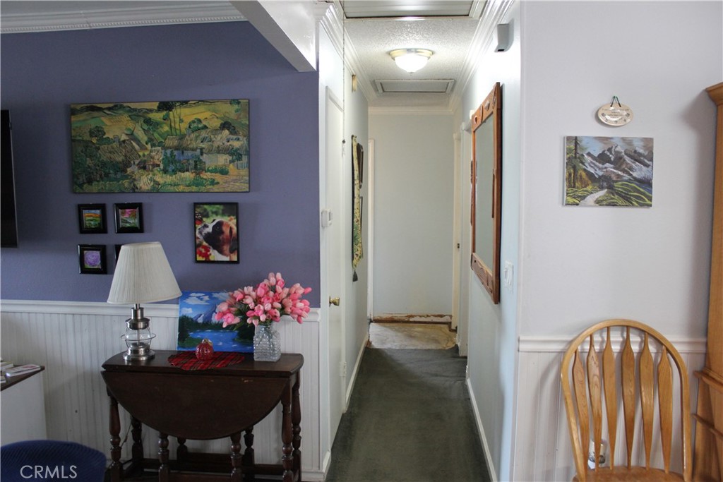5911 Green Valley Road Riverside, CA 92504 - Photo 22 of 24 a dining room with furniture and flowers