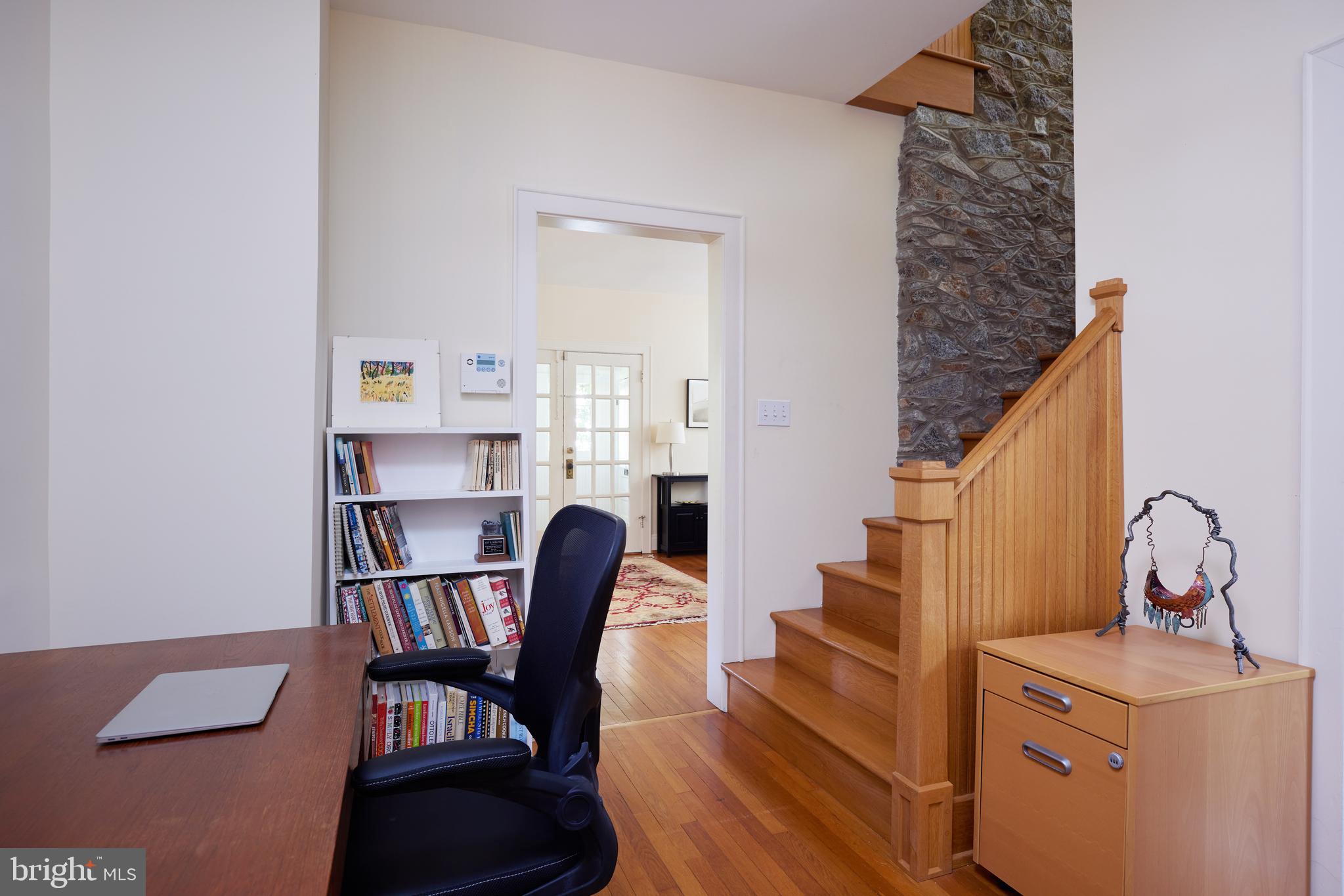 4236 River Road Northwest Washington, DC 20016 - Photo 29 of 44 a view of a workspace with furniture and staircase