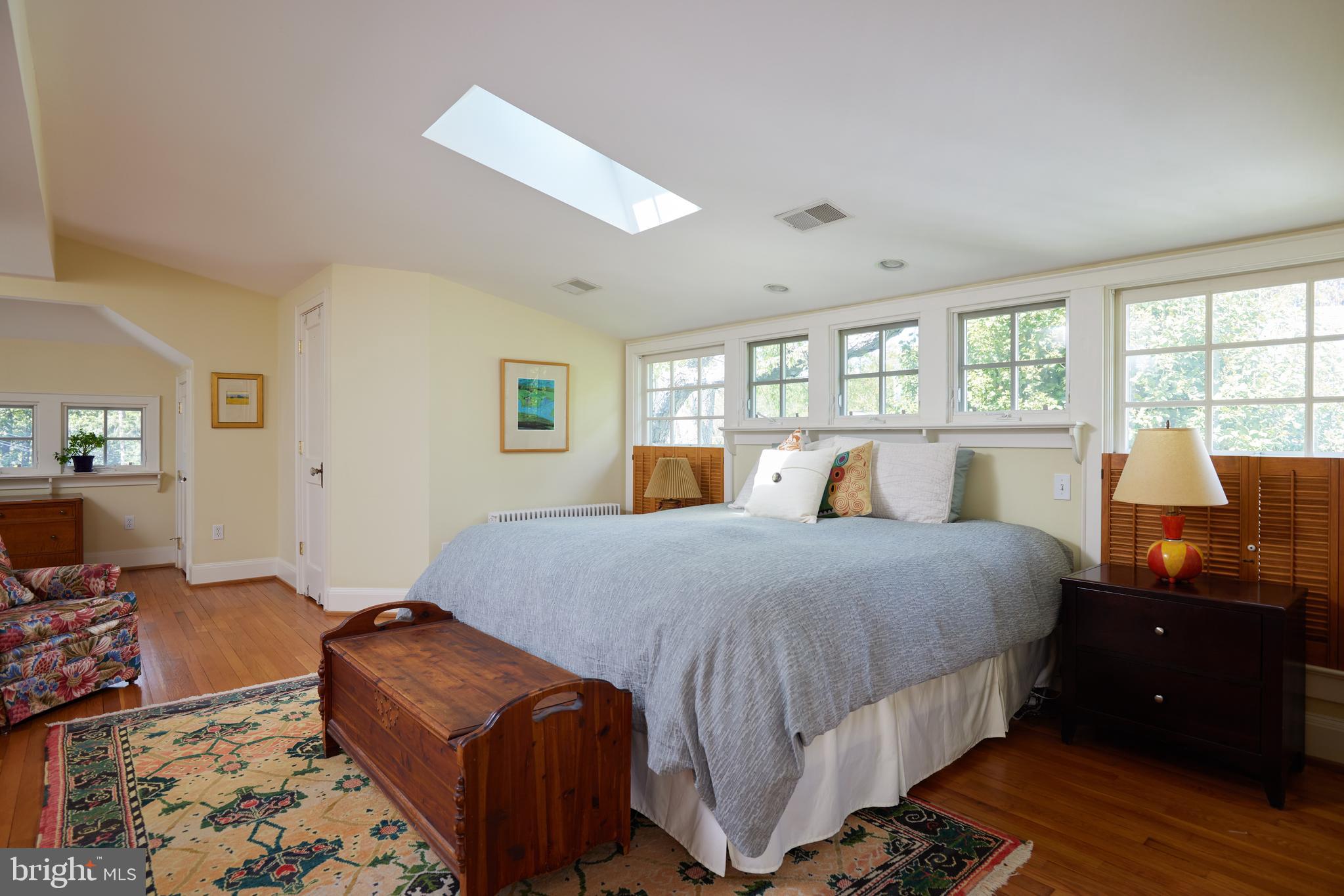 4236 River Road Northwest Washington, DC 20016 - Photo 31 of 44 a bedroom with a bed and wooden floor