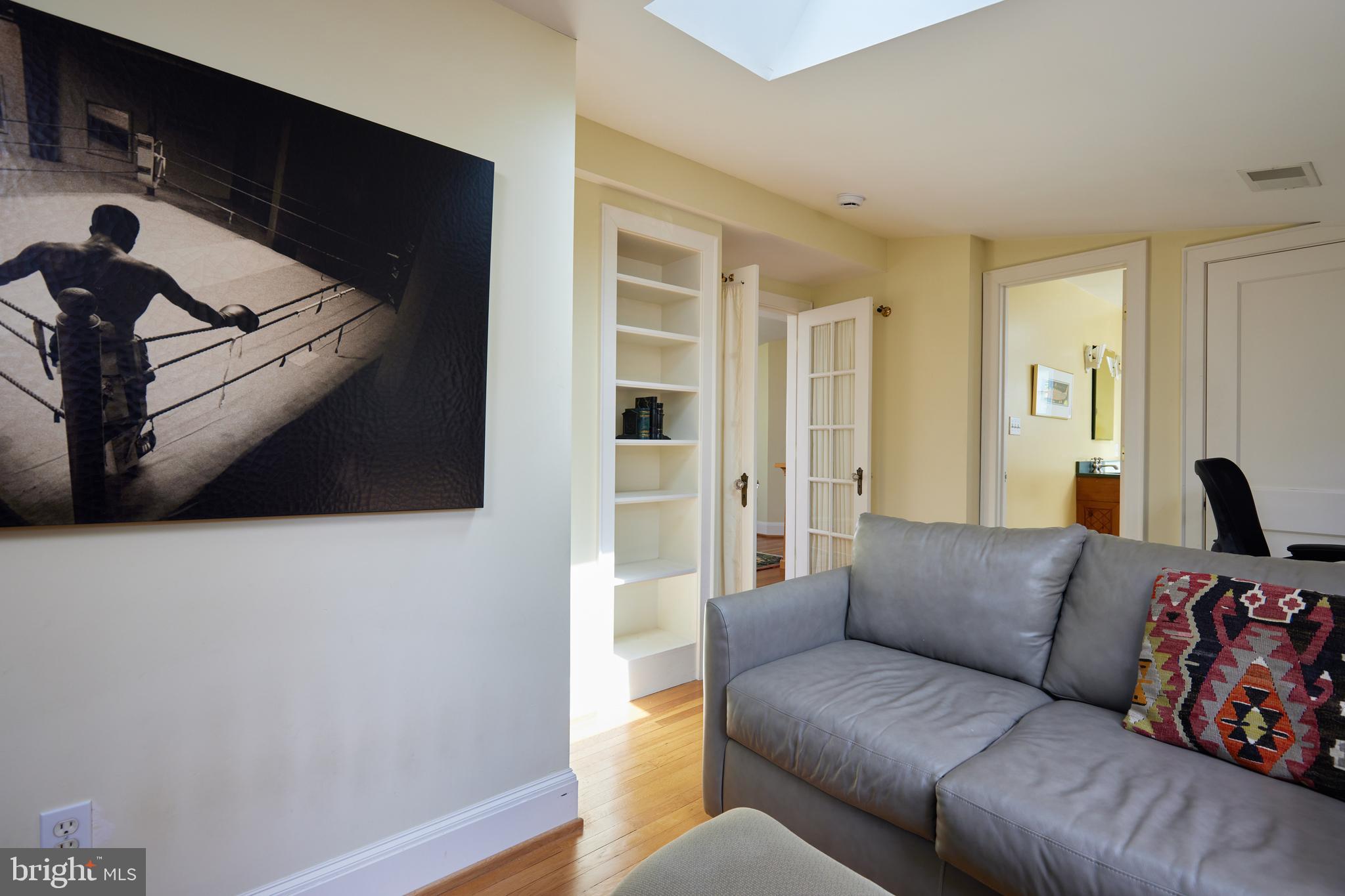 4236 River Road Northwest Washington, DC 20016 - Photo 37 of 44 a living room with furniture and a flat screen tv