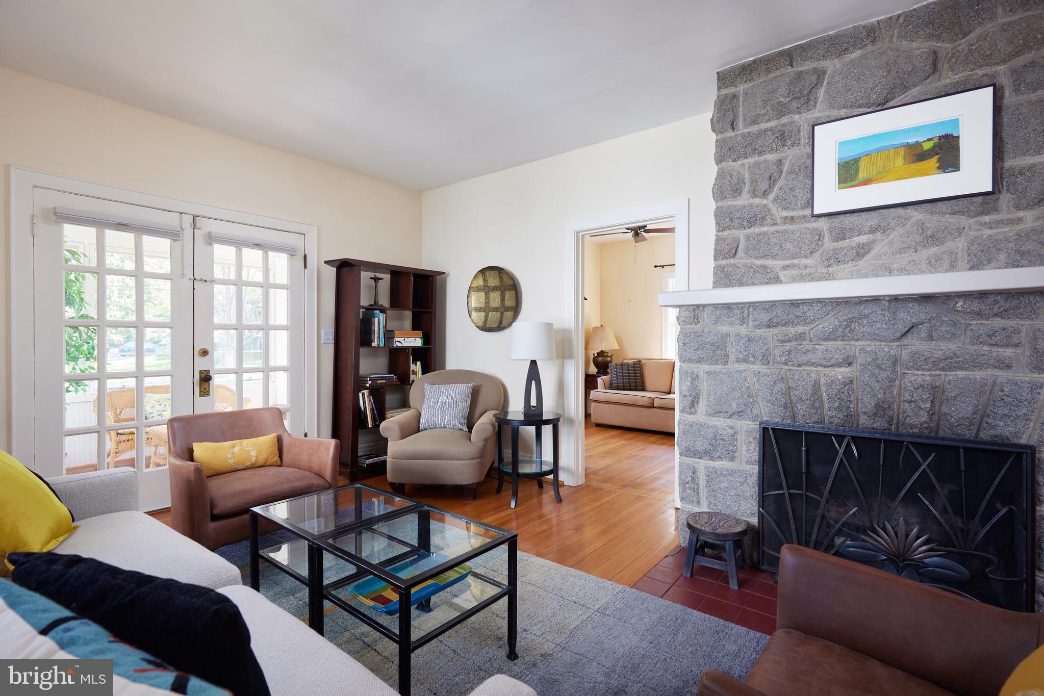 4236 River Road Northwest Washington, DC 20016 - Photo 6 of 44 a living room with furniture and a fireplace