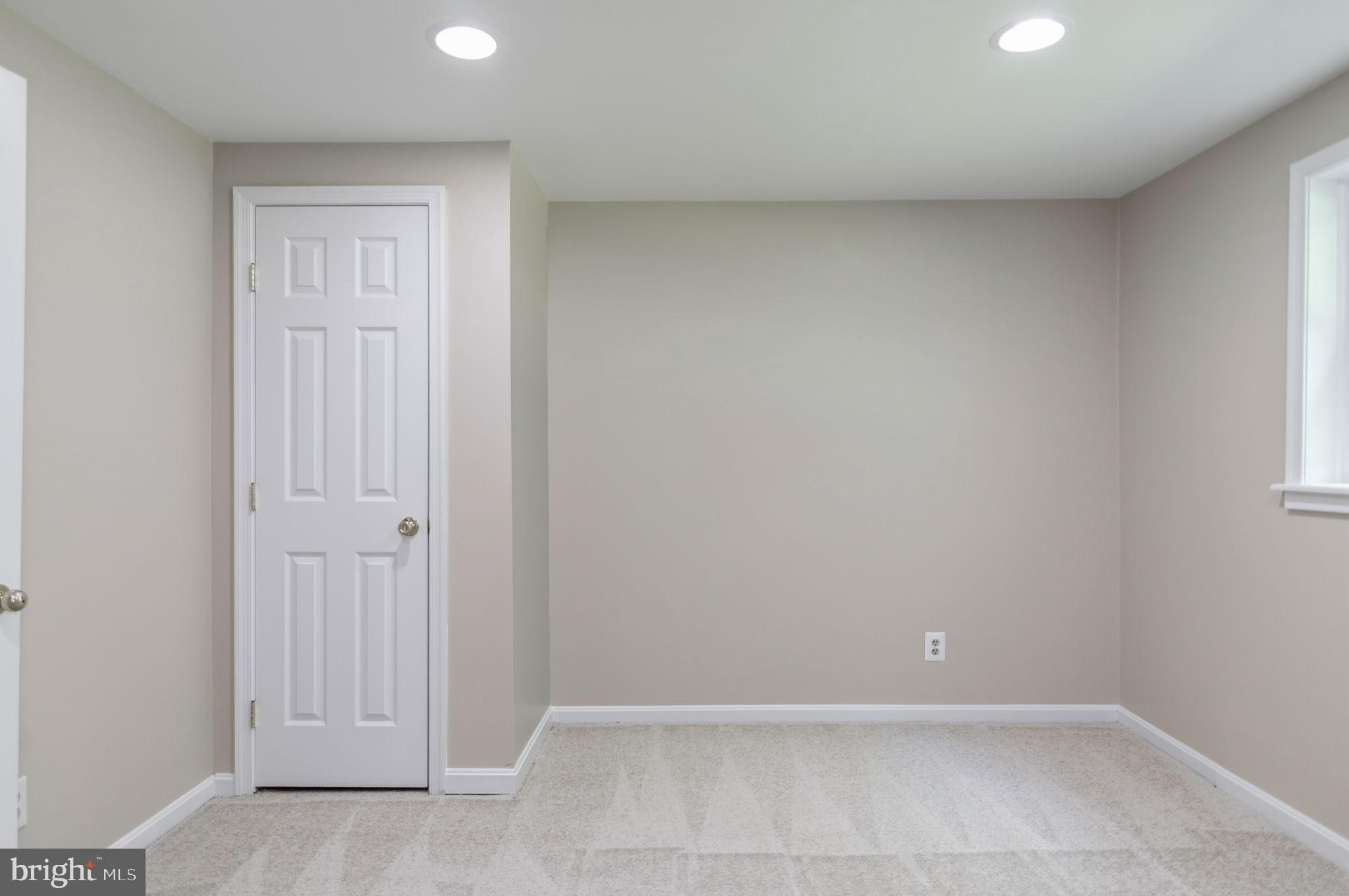 13593 Bethel Road Manassas, VA 20112 - Photo 42 of 54 4th lower level bedroom 18'11x9'7