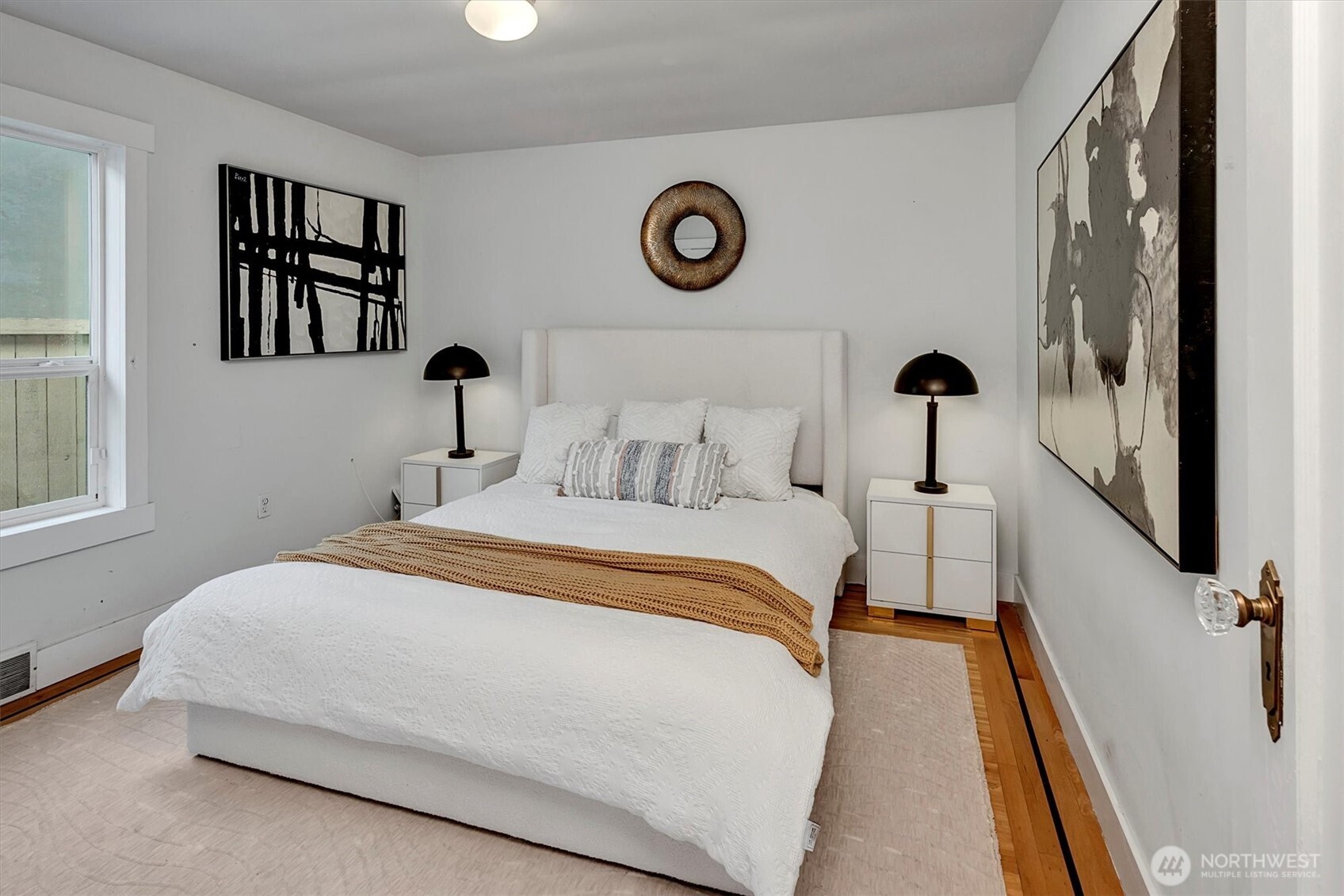 1112 North 80th Street Seattle, WA 98103 - Photo 14 of 29 a bedroom with a bed and a window