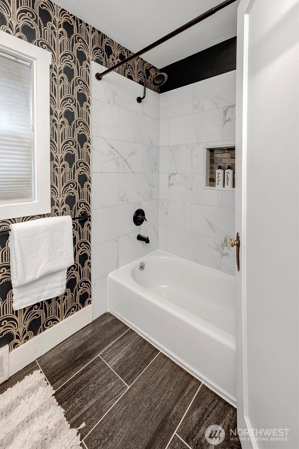 1112 North 80th Street Seattle, WA 98103 - Photo 16 of 29 a bathroom with a bathtub and a shower