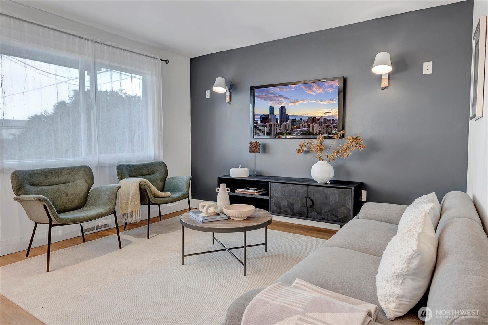 1112 North 80th Street Seattle, WA 98103 - Photo 4 of 29 a living room with furniture and a potted plant