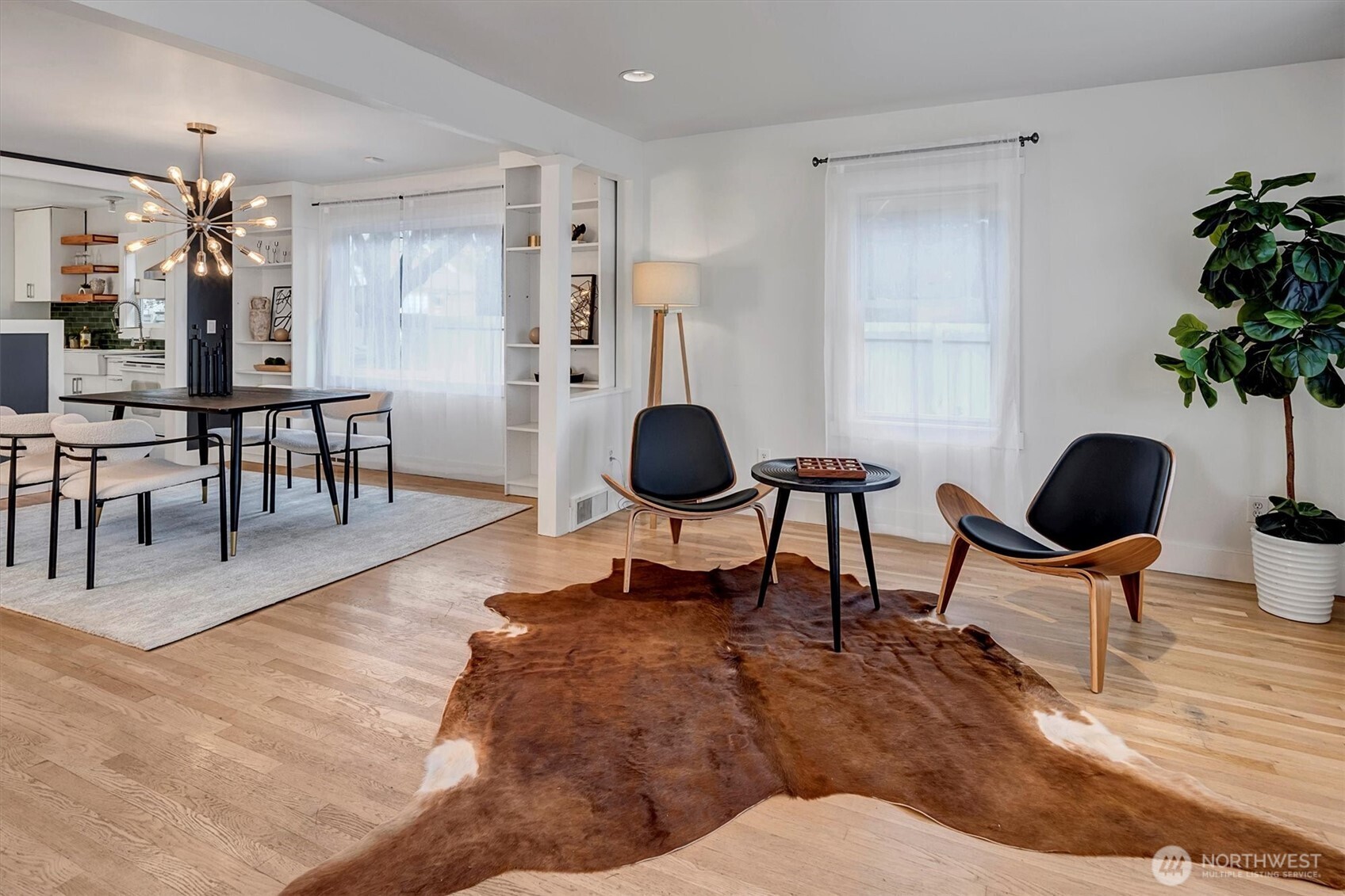 1112 North 80th Street Seattle, WA 98103 - Photo 5 of 29 a living room with furniture and a potted plant