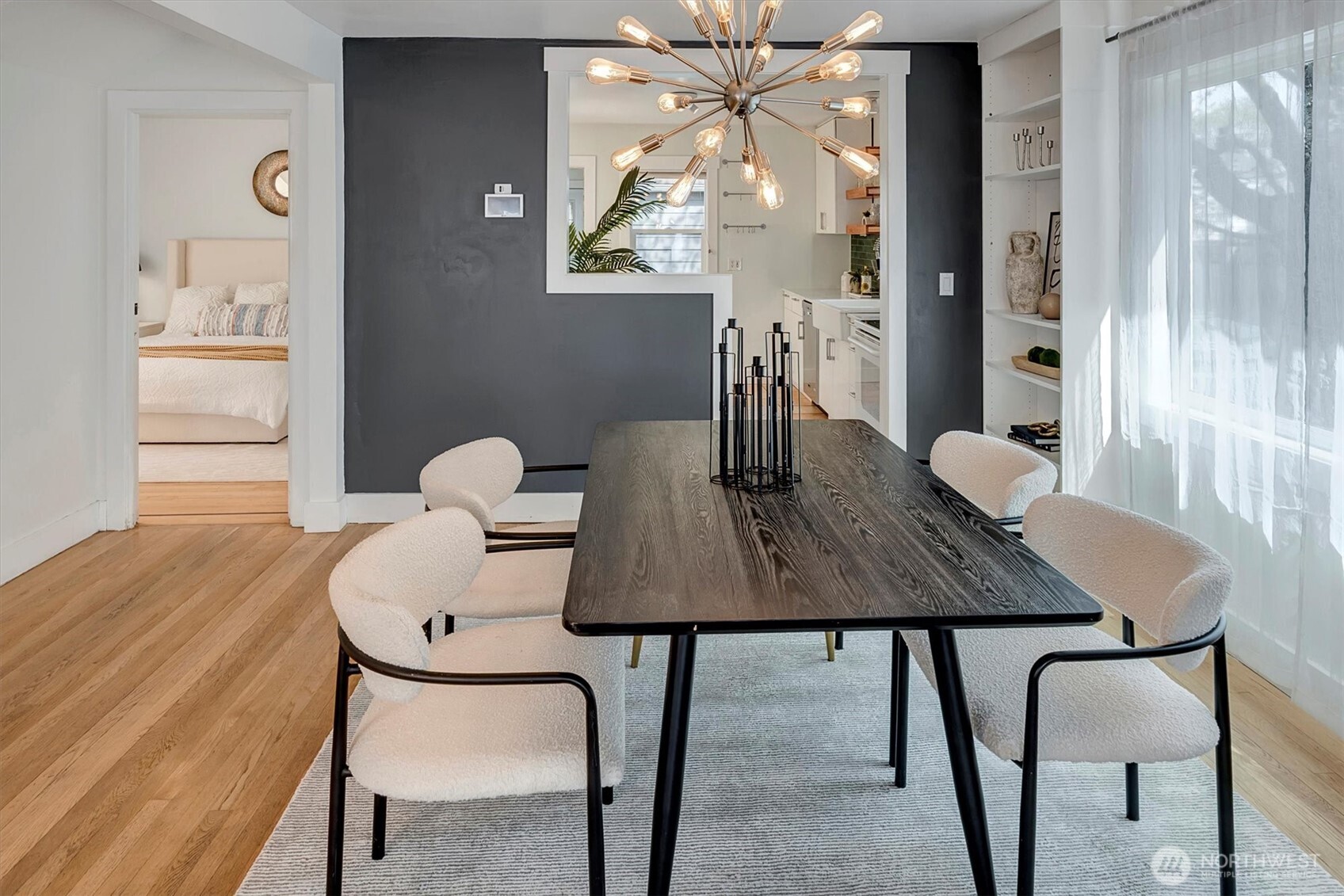 1112 North 80th Street Seattle, WA 98103 - Photo 7 of 29 a view of a dining room with furniture and wooden floor
