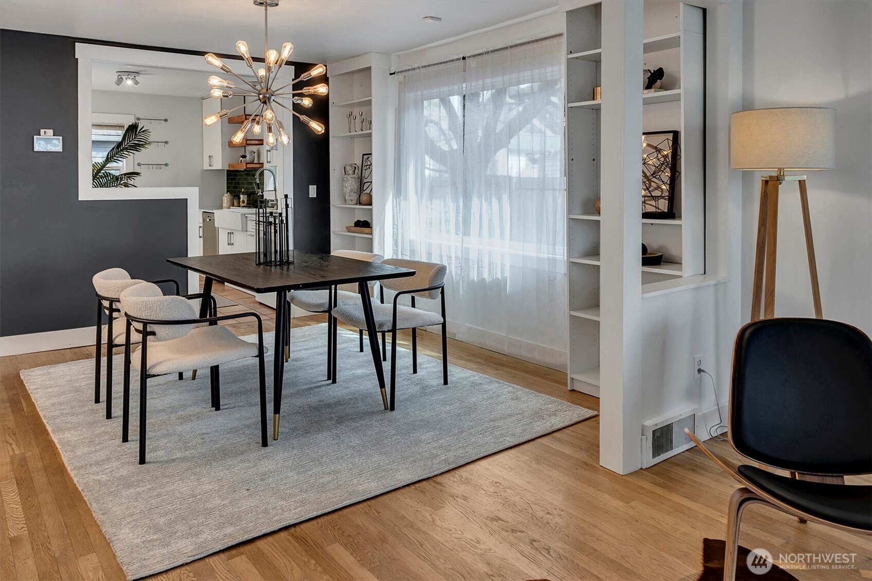 1112 North 80th Street Seattle, WA 98103 - Photo 8 of 29 a view of a dining room with furniture and chandelier