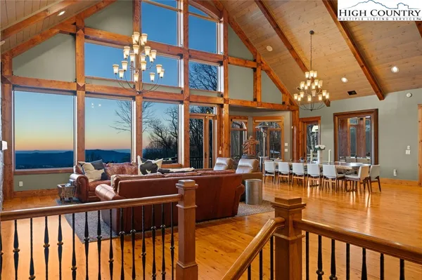 a view of a chairs and table in the balcony