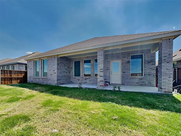 a view of a house with a yard and porch