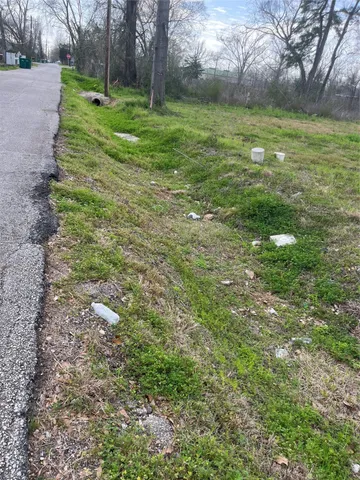 a view of a green field with clear sky