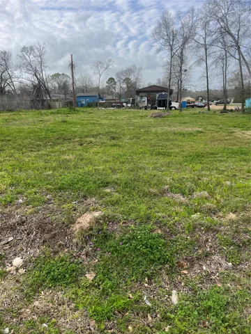 a view of a big yard with a house