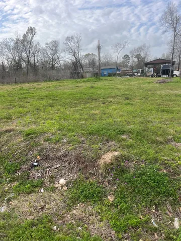 a view of outdoor space with trees all around