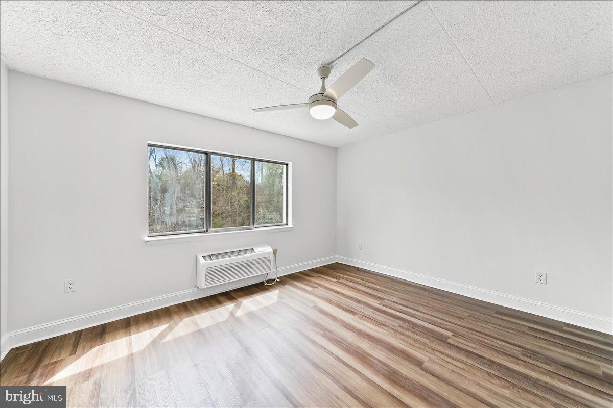 800 Avondale Road, Unit 5Q Wallingford, PA 19086 - Photo 13 of 25 wooden floor in an empty room with a window