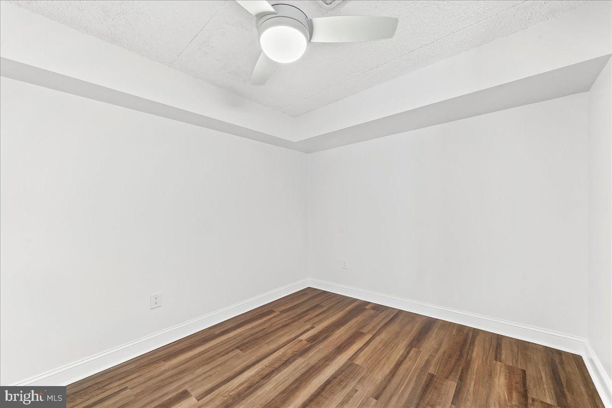 800 Avondale Road, Unit 5Q Wallingford, PA 19086 - Photo 17 of 25 a view of a room with wooden floor and fan
