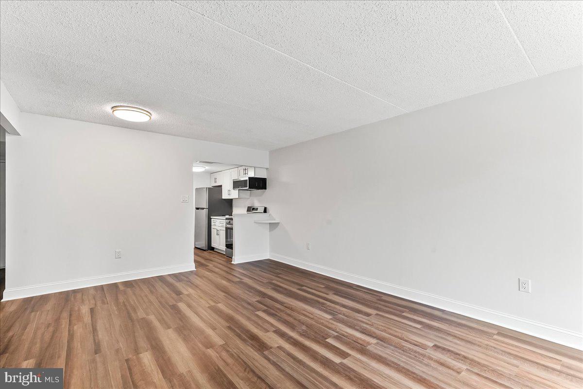 800 Avondale Road, Unit 5Q Wallingford, PA 19086 - Photo 8 of 25 a view of empty room with wooden floor
