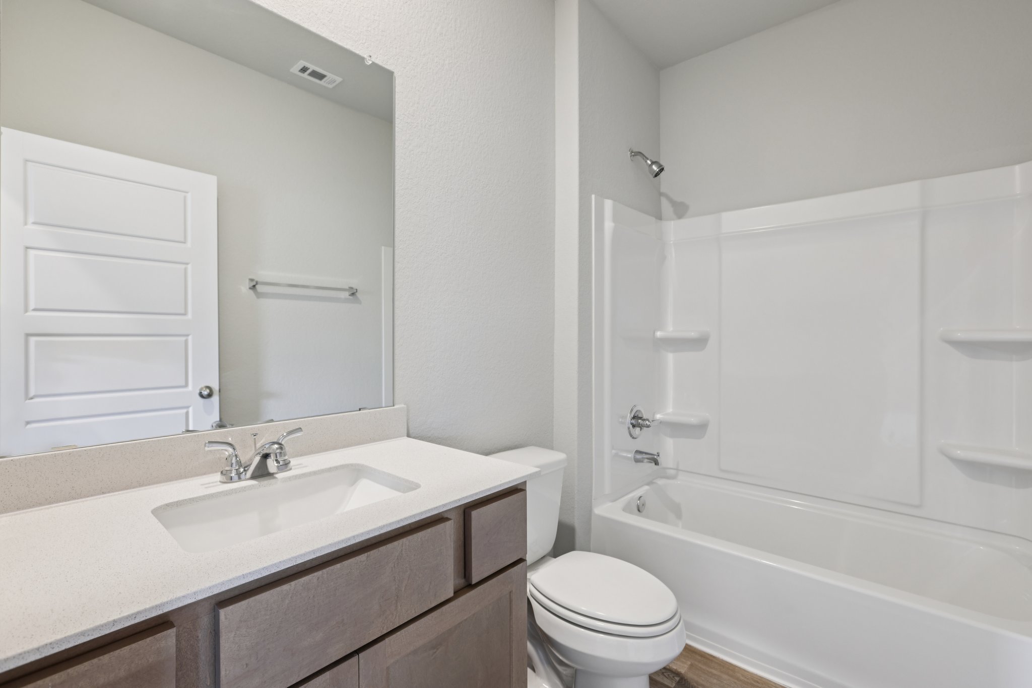 127 Tempest Trail Maxwell, TX 78656 - Photo 14 of 29 a bathroom with a granite countertop sink a toilet and shower
