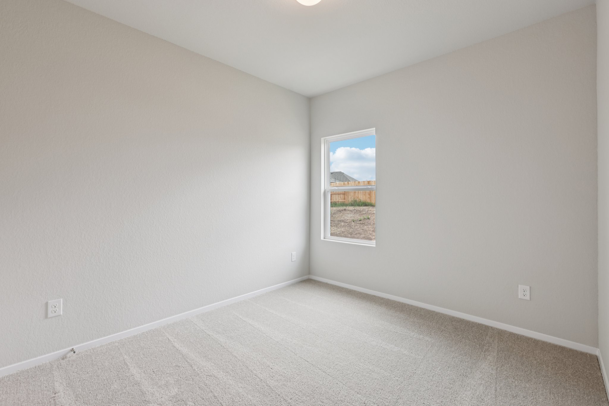 127 Tempest Trail Maxwell, TX 78656 - Photo 18 of 29 a view of an empty room with a window