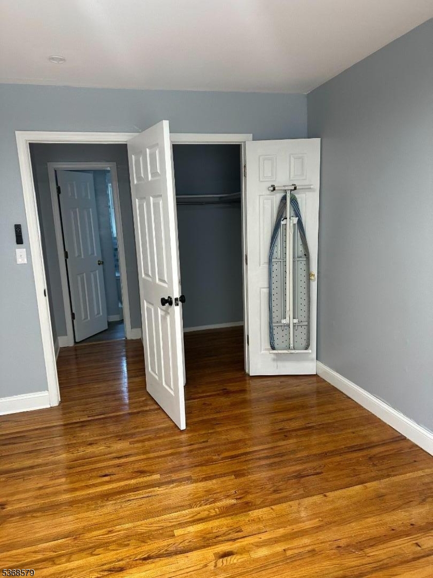 12A Gramercy Gardens Place, Unit 12 Middlesex, NJ 08846 - Photo 2 of 7 a view of empty room with wooden floor