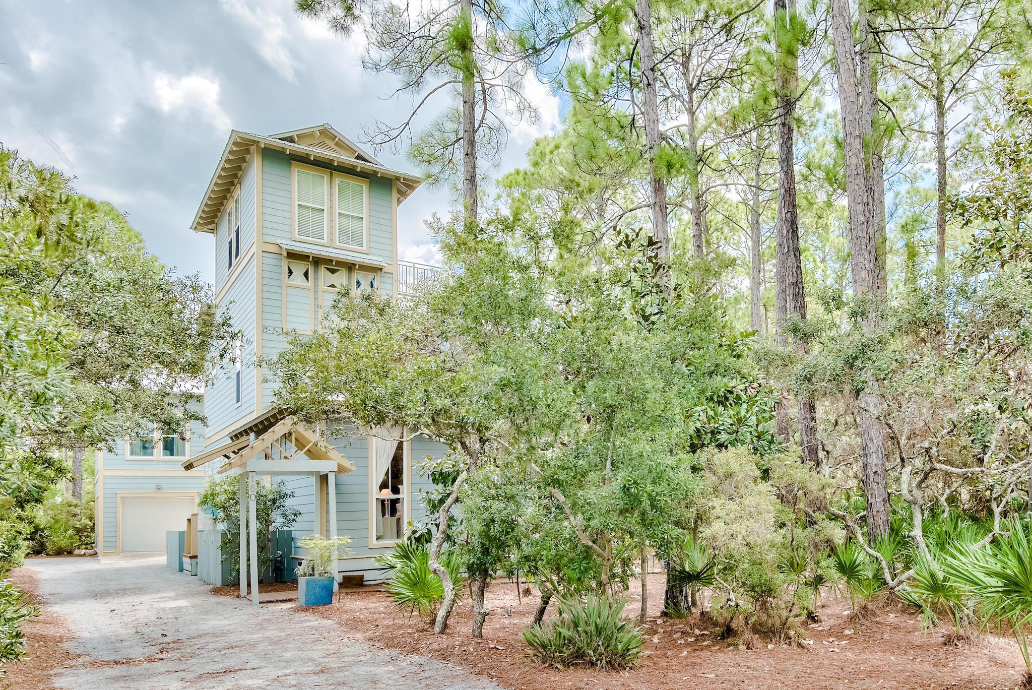 160 North Andalusia Avenue Santa Rosa Beach, FL 32459 - Photo 1 of 61 a front view of a house with a yard and garage