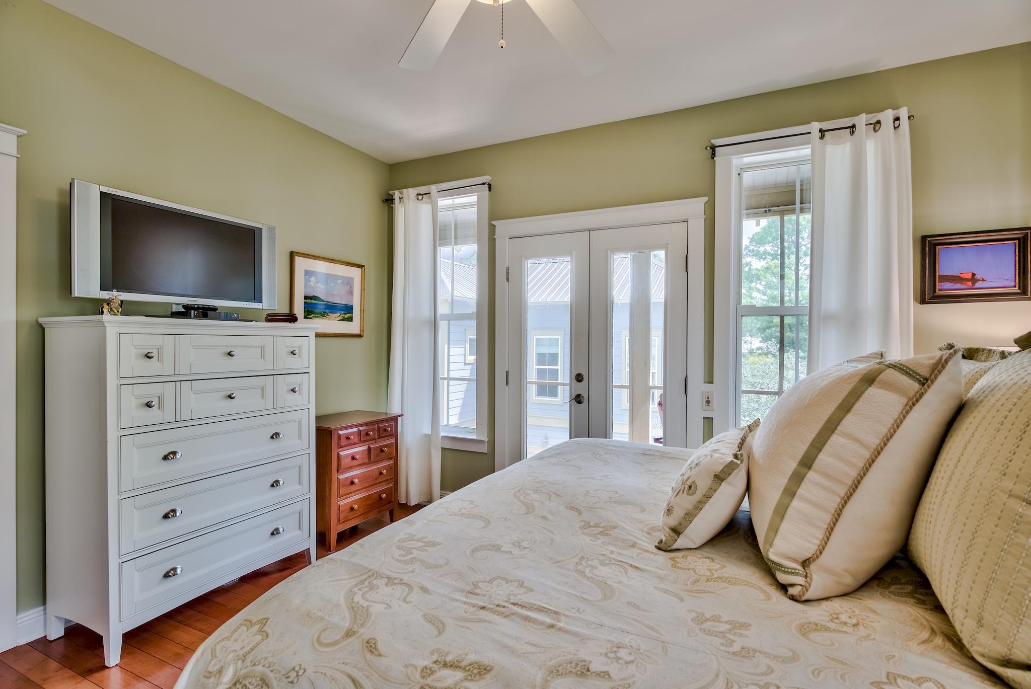 160 North Andalusia Avenue Santa Rosa Beach, FL 32459 - Photo 22 of 61 a bedroom with a bed and flat screen tv