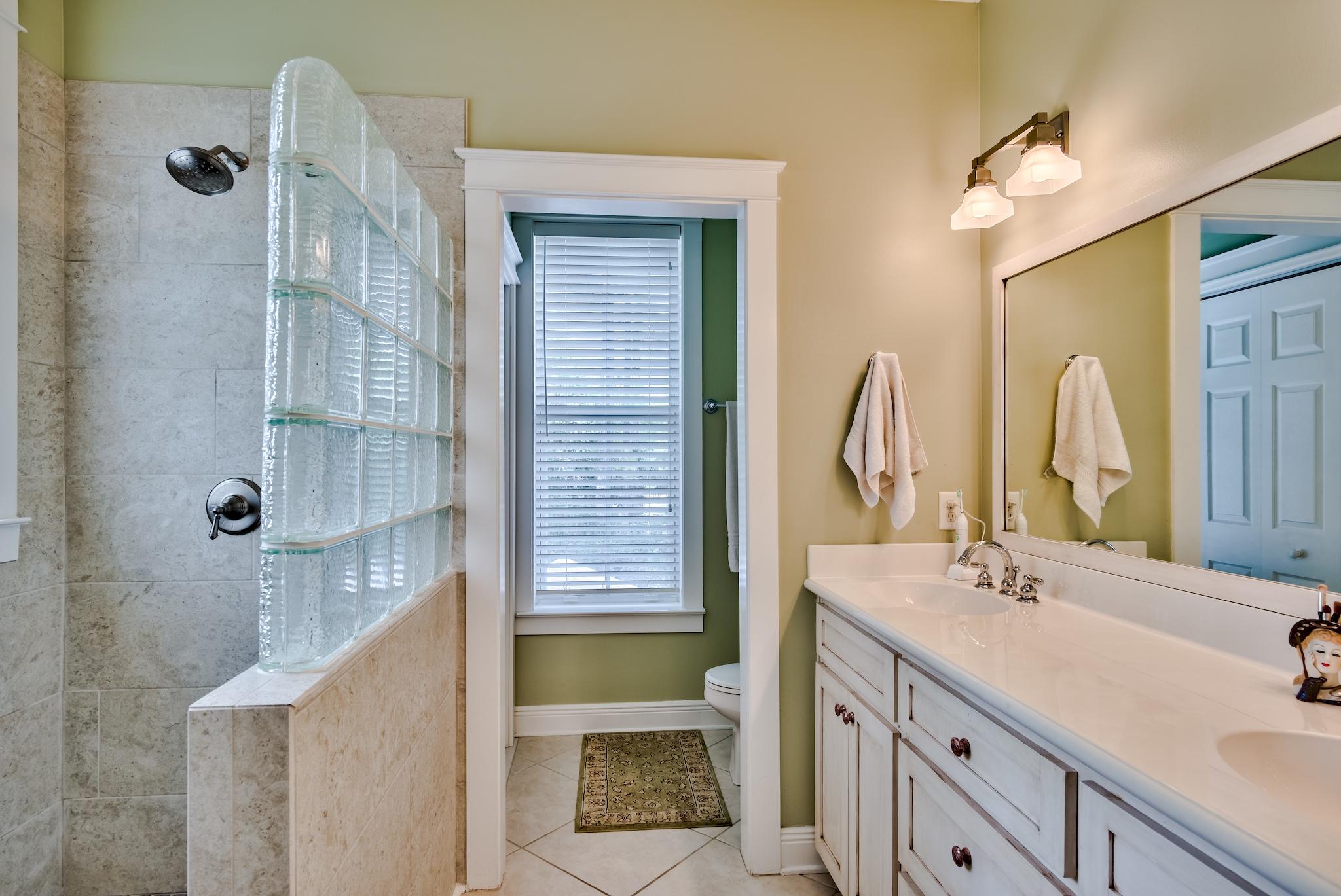 160 North Andalusia Avenue Santa Rosa Beach, FL 32459 - Photo 24 of 61 a bathroom with a double vanity sink mirror and bathtub