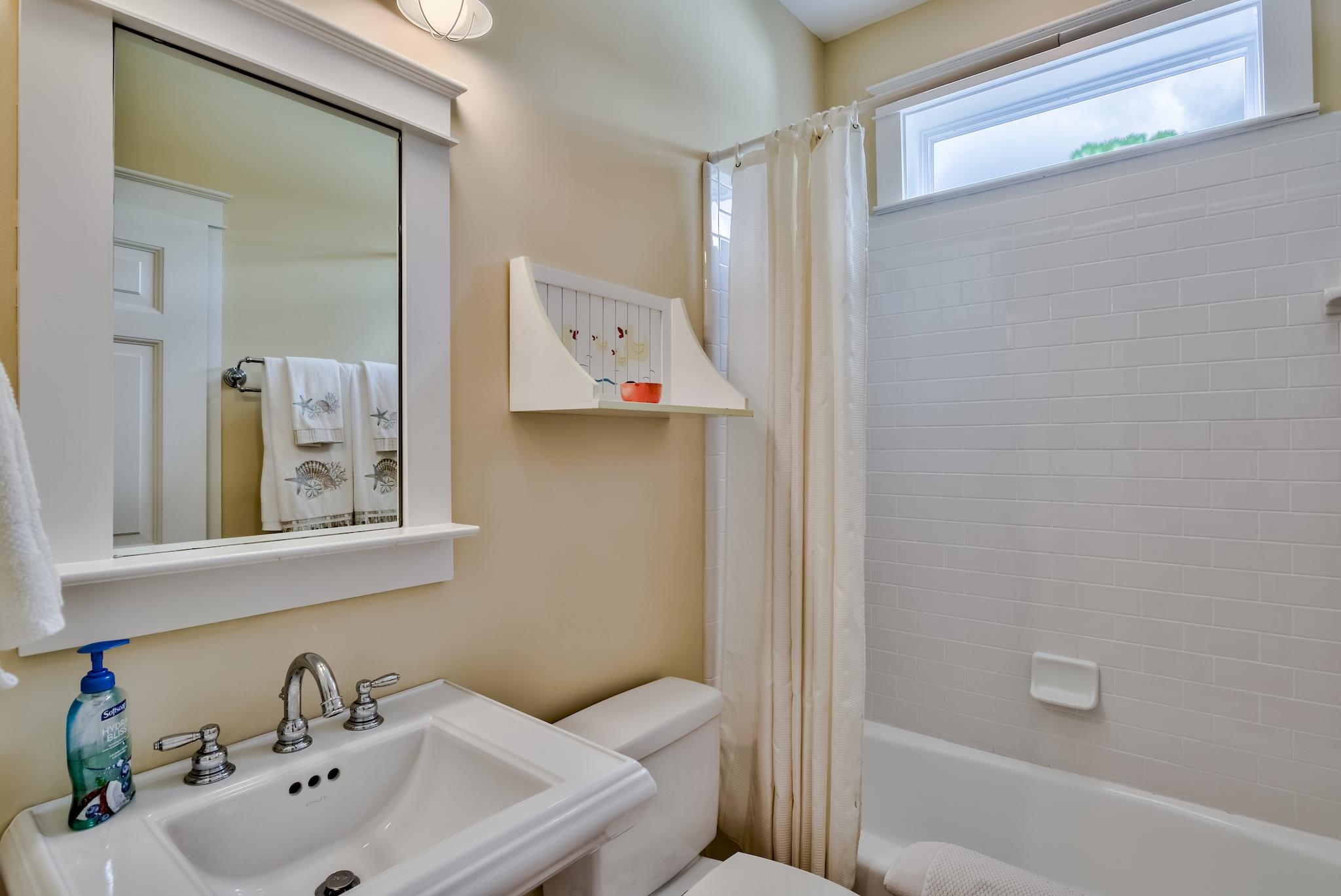 160 North Andalusia Avenue Santa Rosa Beach, FL 32459 - Photo 26 of 61 a bathroom with a toilet sink and mirror