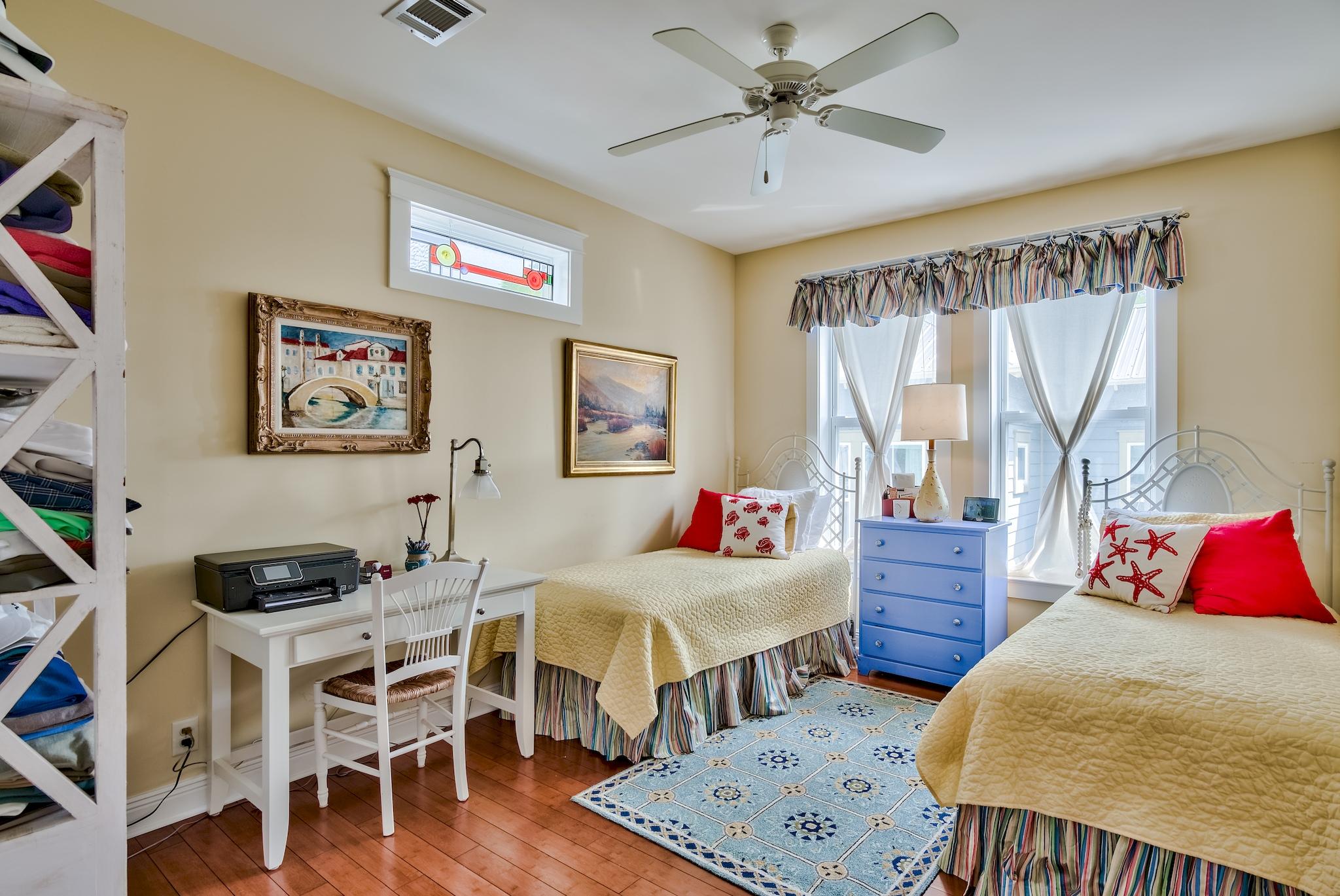 160 North Andalusia Avenue Santa Rosa Beach, FL 32459 - Photo 27 of 61 a bedroom with furniture and a wooden floor