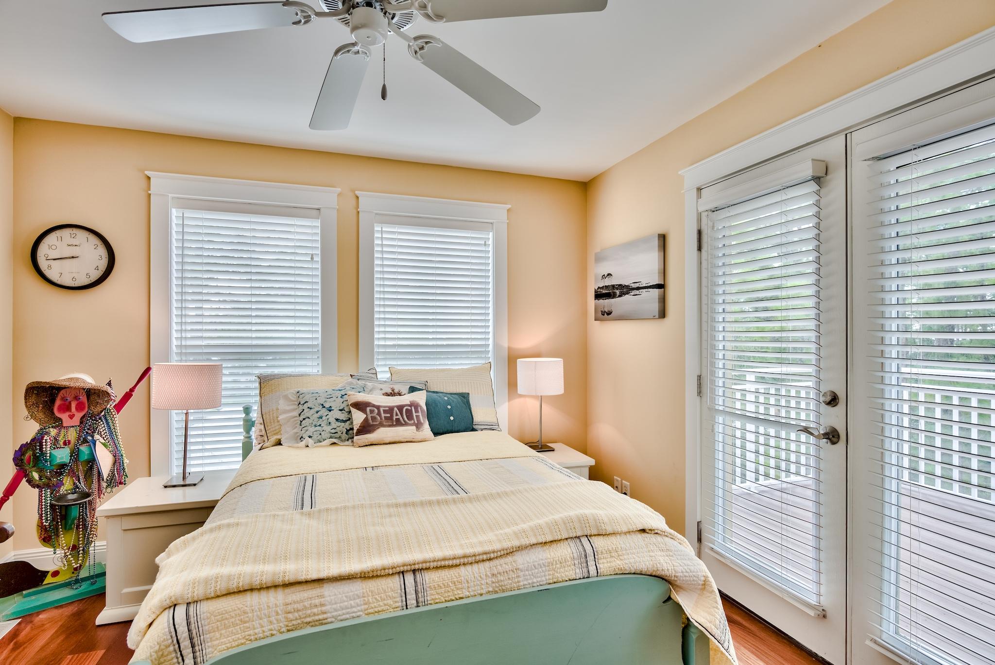 160 North Andalusia Avenue Santa Rosa Beach, FL 32459 - Photo 29 of 61 a bedroom with a bed and a chandelier