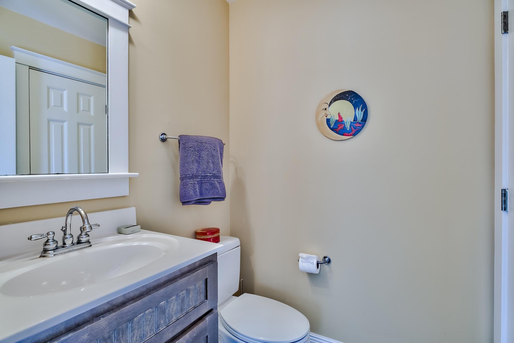 160 North Andalusia Avenue Santa Rosa Beach, FL 32459 - Photo 34 of 61 a bathroom with a sink a toilet and a mirror